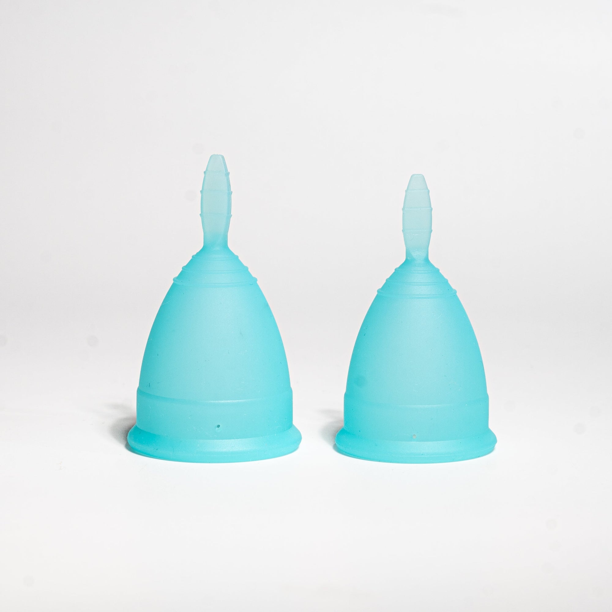 Perfectfit menstrual cup soft blue detail 2 pieces side by side
